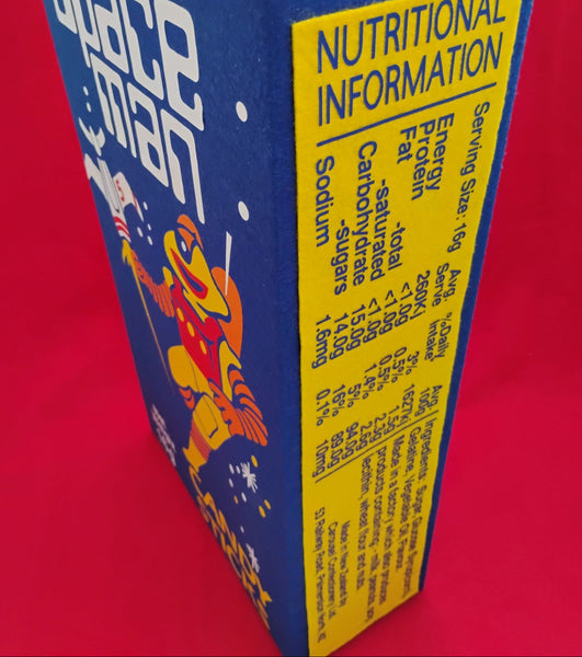 Close-up of a 'Space Man' snack package with nutritional information on a red background