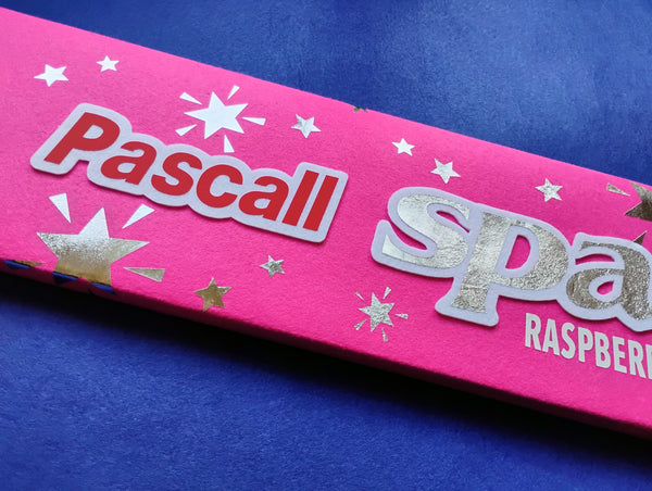 Pink Sparkles packaging with 'Pascall' branding on a blue background