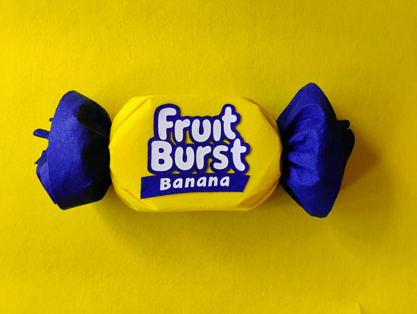 Fruit Burst Banana candy on a yellow background