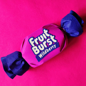Pink and blue Fruit Burst Wildberry candy on a pink background